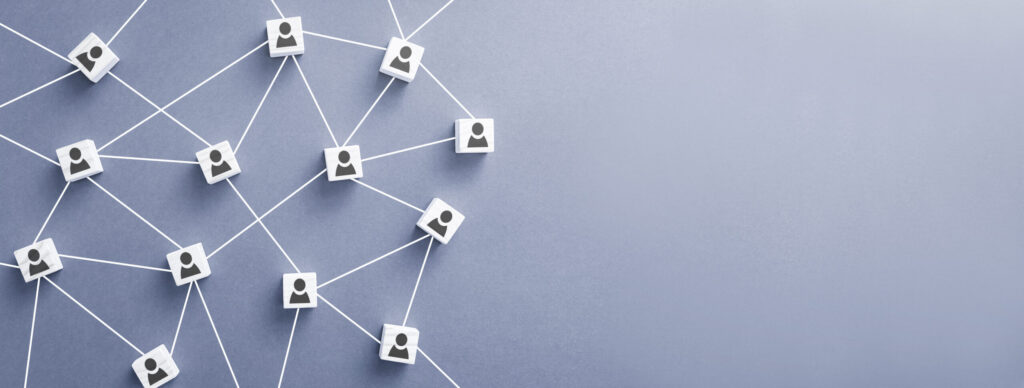 Converged Growth B2B GTM Model represented by an interconnected grid of people icons on dice