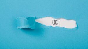 The Real Cost of a Short-term Demand Marketing Mindset is just beneath the surface, in the image, it's under a blue piece of paper
