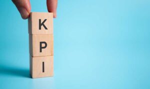 Demand Marketing KPI System represented as a stack of wooden blocks
