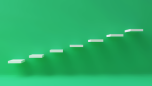 An image of floating white steps ascending left to right on a bright green background